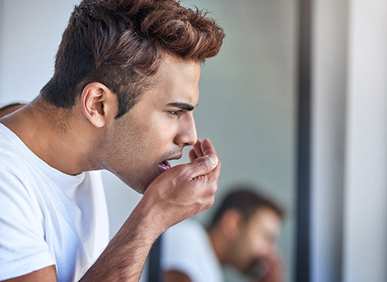 Man checking his breath