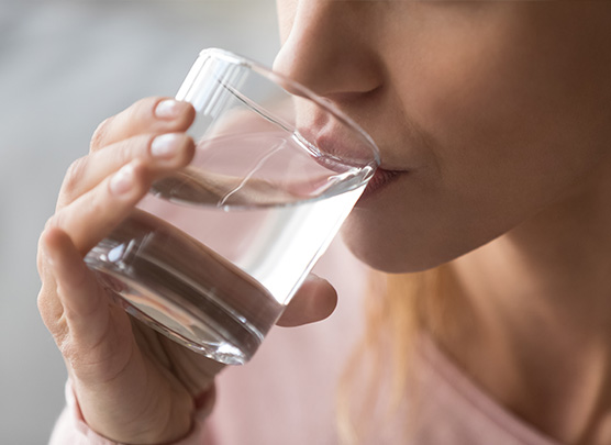 Woman drinking glass of water