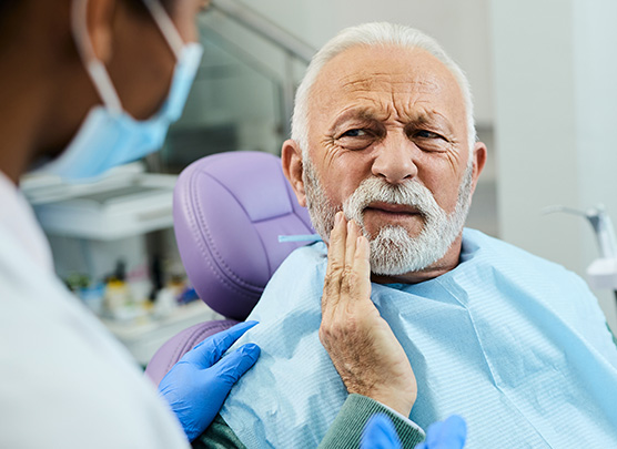 Man experiencing tooth pain