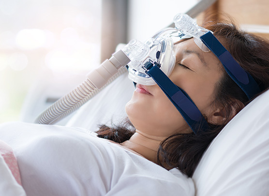 Woman wearing CPAP machine